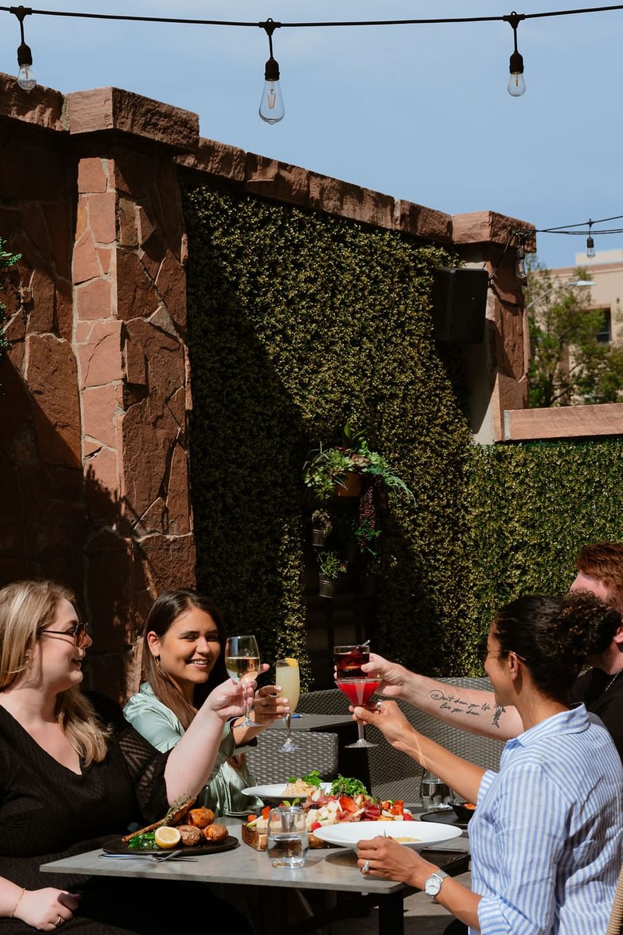 Friends on the terrace enjoying a drink in the sun