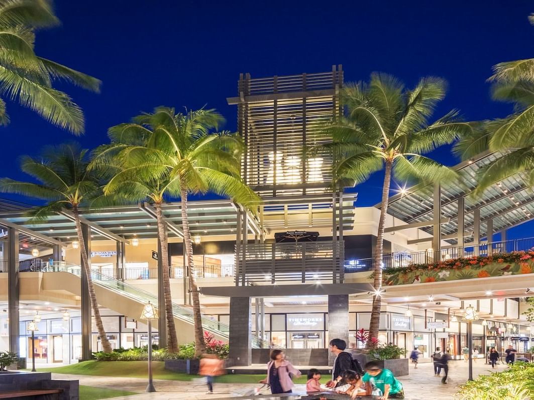 Exterior view of the shopping mall of Ala Moana Center at night near Waikiki Resort Hotel