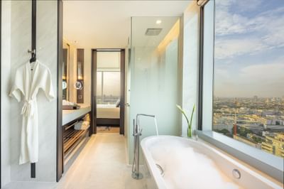 Bathtub with city view in Premium Deluxe with Lounge Access at Eastin Grand Hotel Phayathai