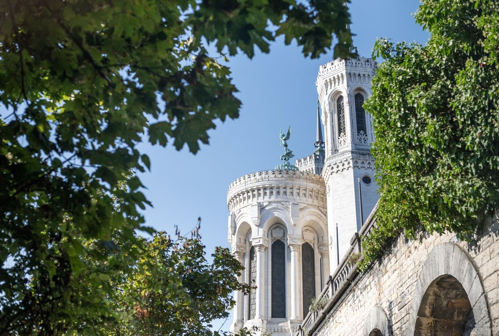 View of the white towers of Notre-Dame de Fourvière Basilica from the Warwick Reine Astrid - Lyon