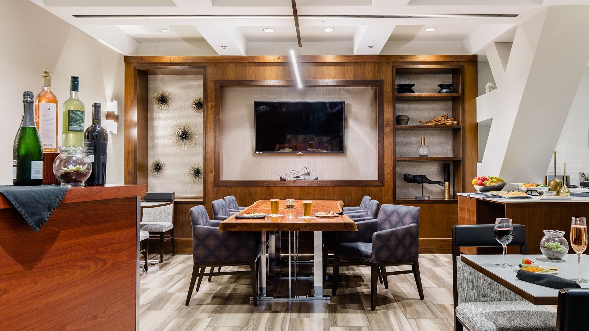 a dining area with a table and chairs