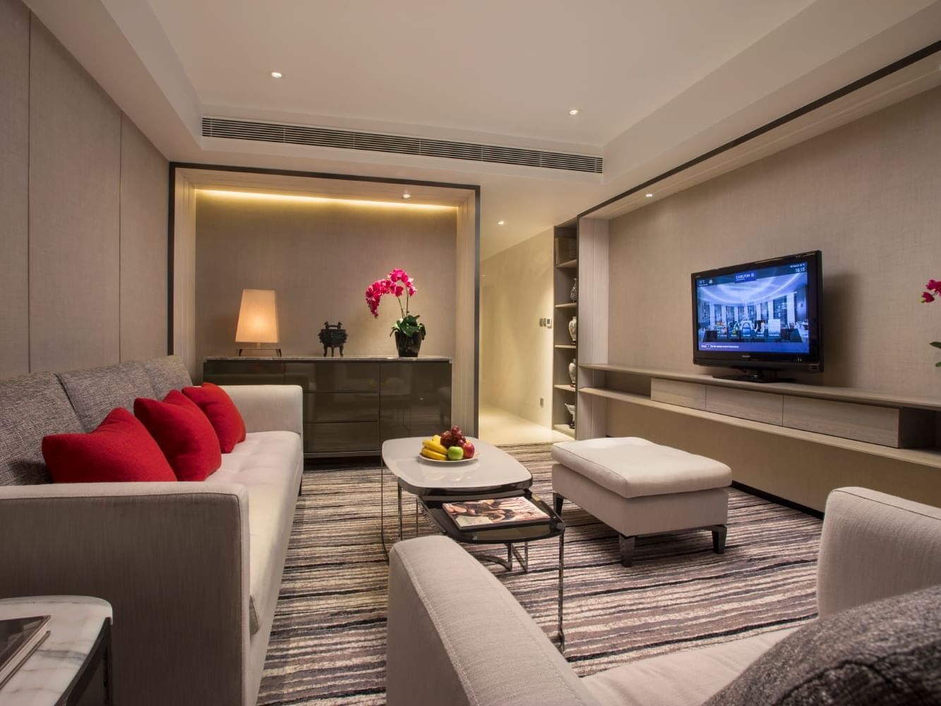 TV lounge area in Deluxe Suite at Carlton Hotel Singapore