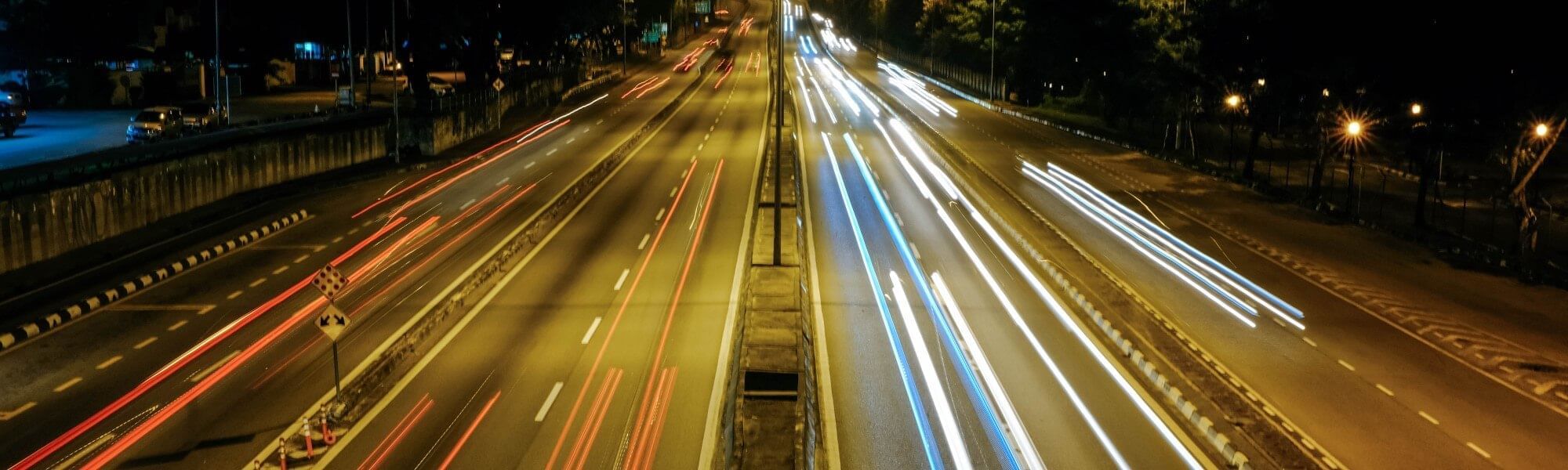 A long exposure night shot of a busy highway near Sunway Velocity Hotel