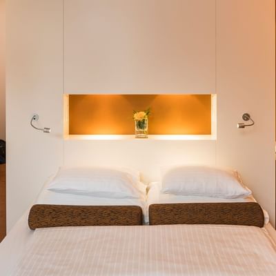 Comfortable bed in Superior Room at Falkensteiner Bratislava