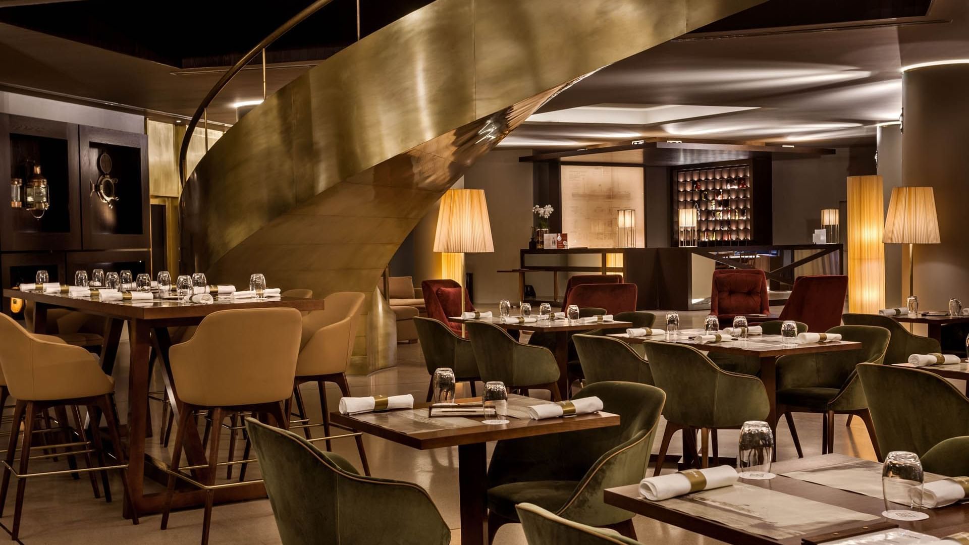 Dining area with a spiral stairway in Vapore Restaurant at Grand Hotel Açores Atlântico