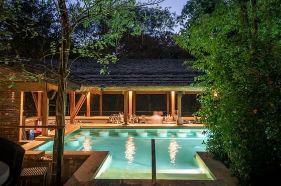 Night view of the outdoor pool area & Bar at Hotel Rio Perdido