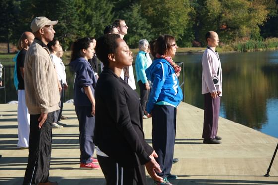 People engaged in outdoor meditation at Honor's Haven