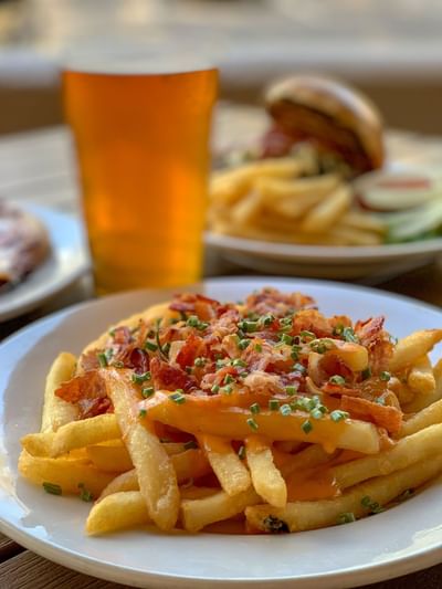 Beer, fries, and burger dish served at Zebra's Sports Bar & Grille