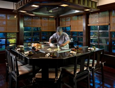 Chef cooking at Kogetsu’s teppanyaki grill with warm wood tones at The Saujana Hotel Kuala Lumpur