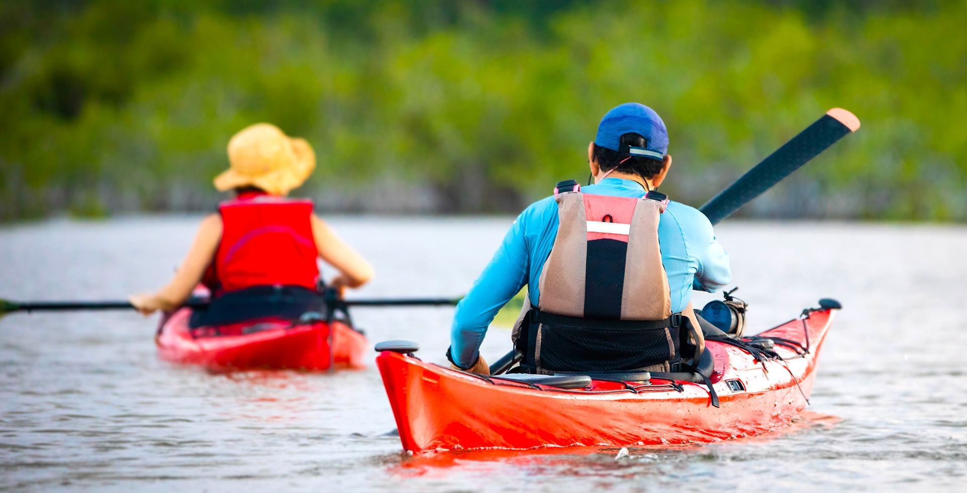 two people kayaking in Courtenay water body