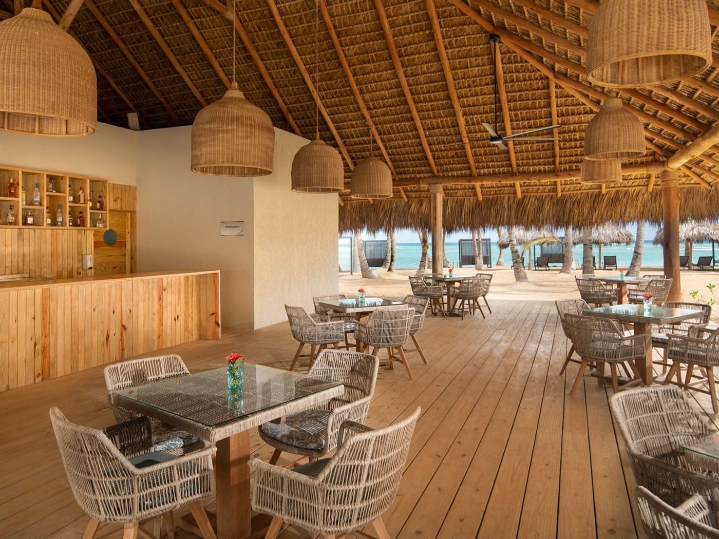 Miraflores indoor dining area with bamboo furniture at Live Aqua Beach Resort Punta Cana