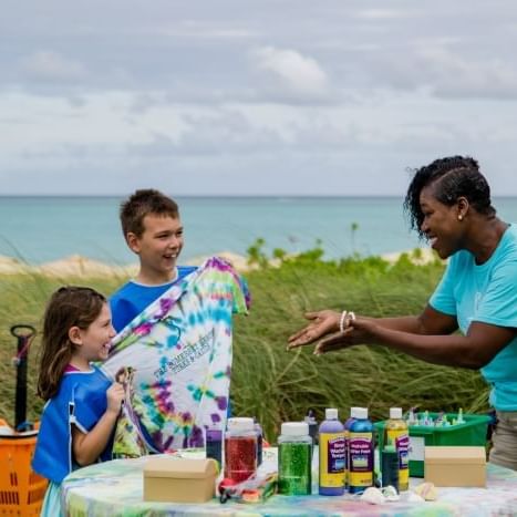Photo of Sharon Scott with children at The Somerset Grace Bay