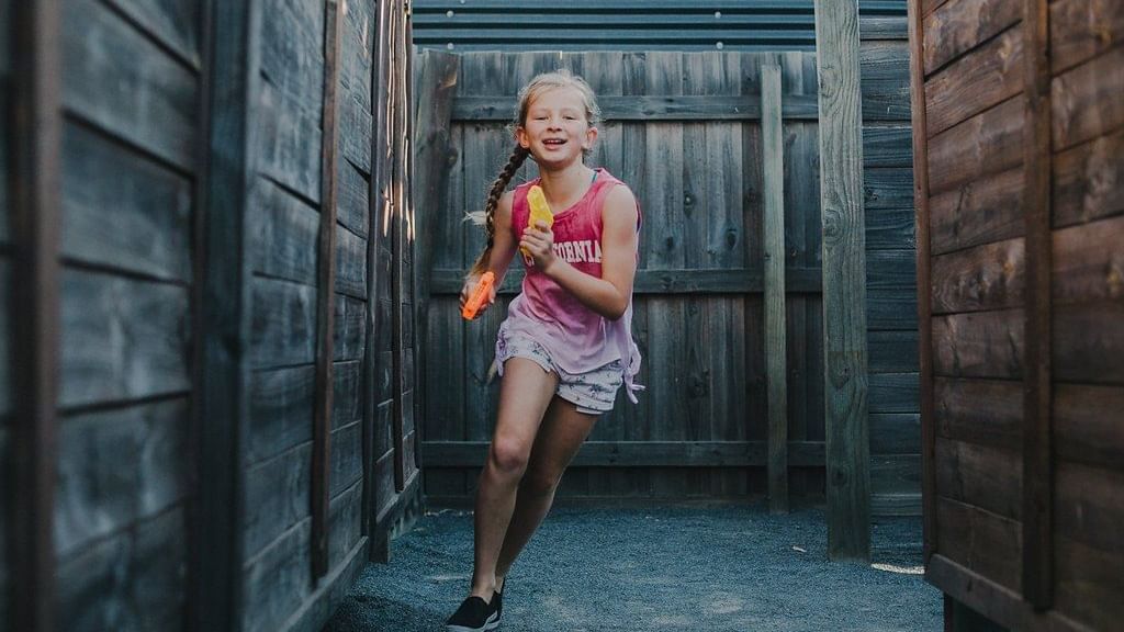 Girl running in a Yallingup Maze near Pullman Bunker Bay Resort
