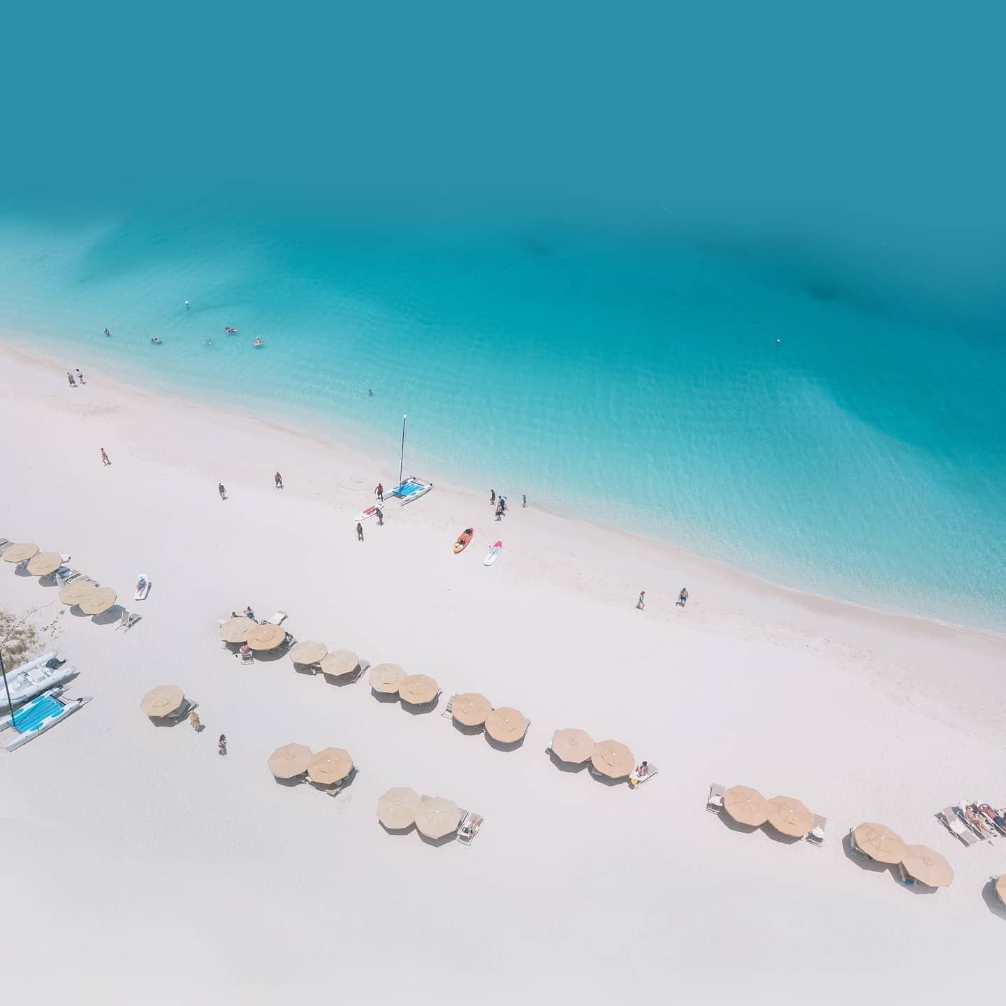 Sky view of the beach & seating area near Somerset On Grace Bay