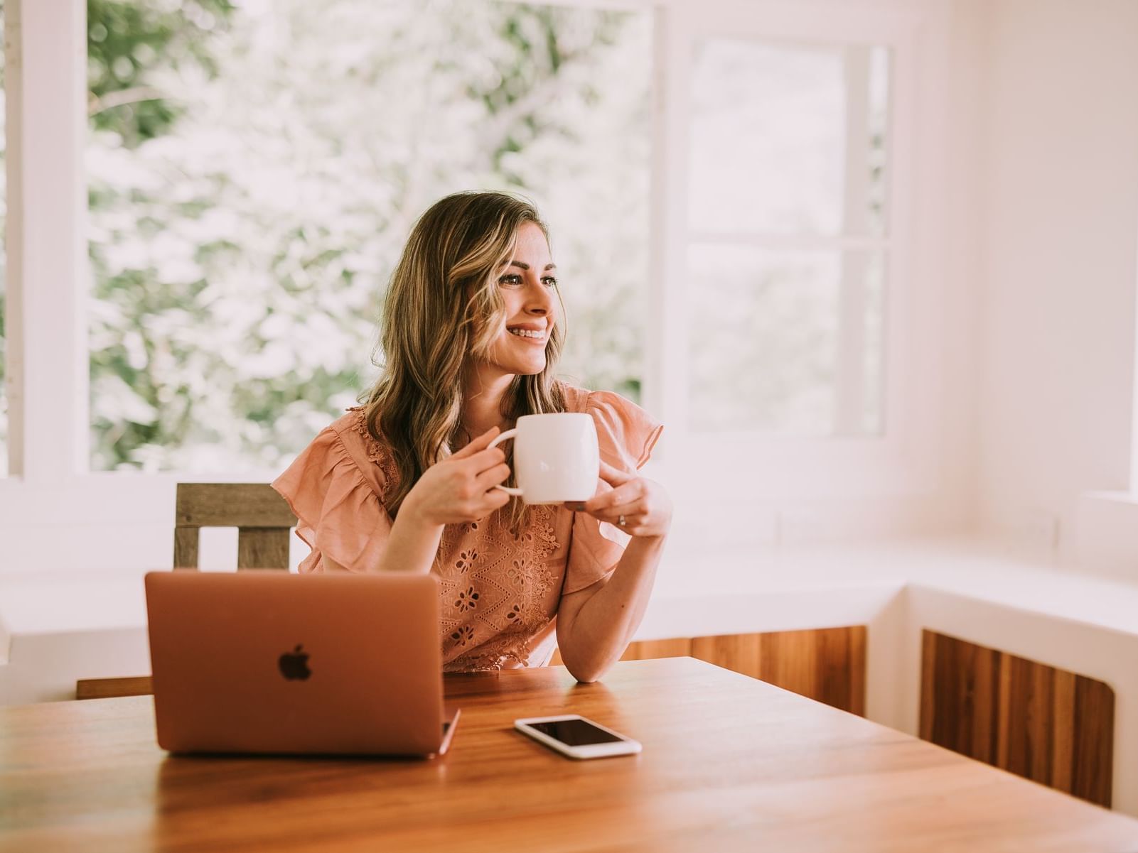 Lady having coffee while working at Retreat Costa Rica