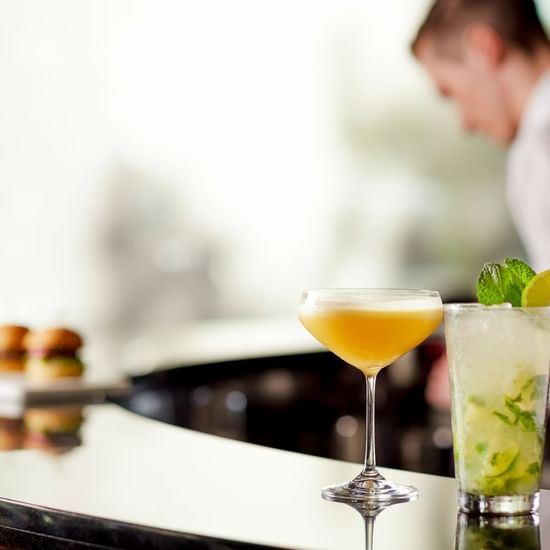 Close-up of a cocktail glass served on a counter at Pullman Albert Park