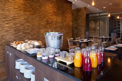 Buffet breakfast station featuring jars of juice & pastries highlighting best Valparaiso Chile restaurants at Veranda Hotel