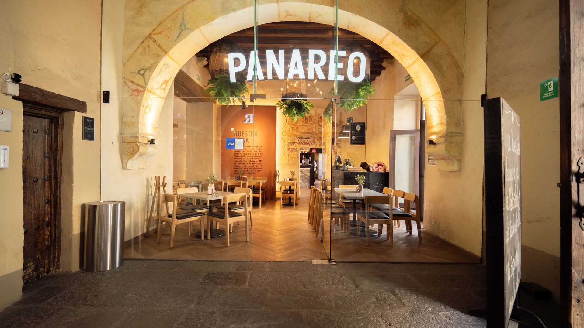 Entrance to Panareo restaurant through a large historic stone archway at Quinta Real Puebla 