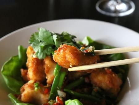 Close-up of a Poulet Croustillent dish served at Warwick Le Crystal