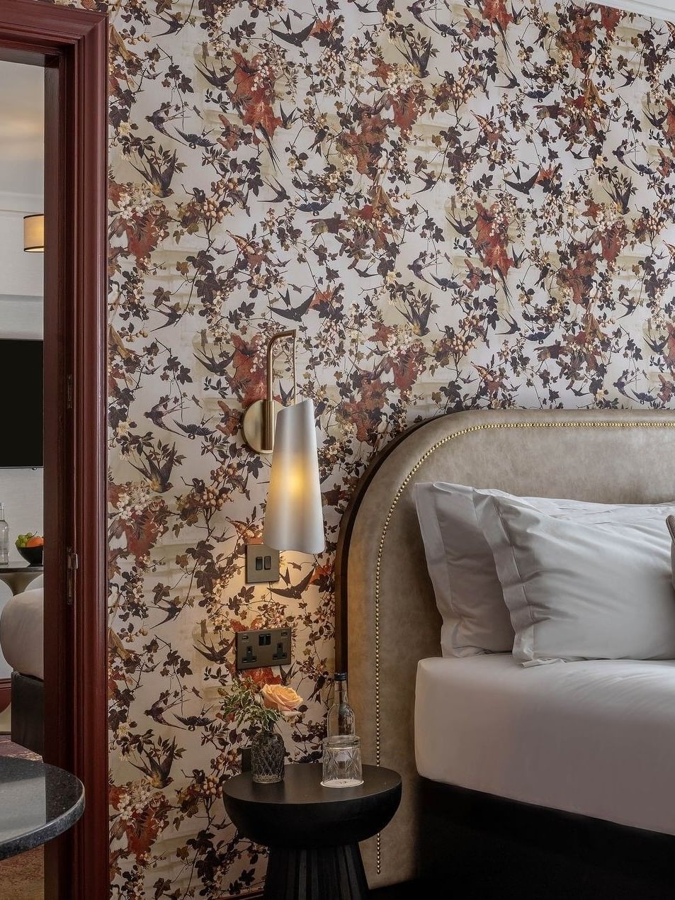 Comfortable Superior Room with floral wallpaper and a fruit bowl at The Capital Hotel
