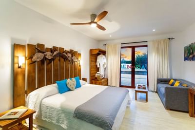 Bedroom arrangement in Cocoa Pod Suite at True Blue Bay Hotel