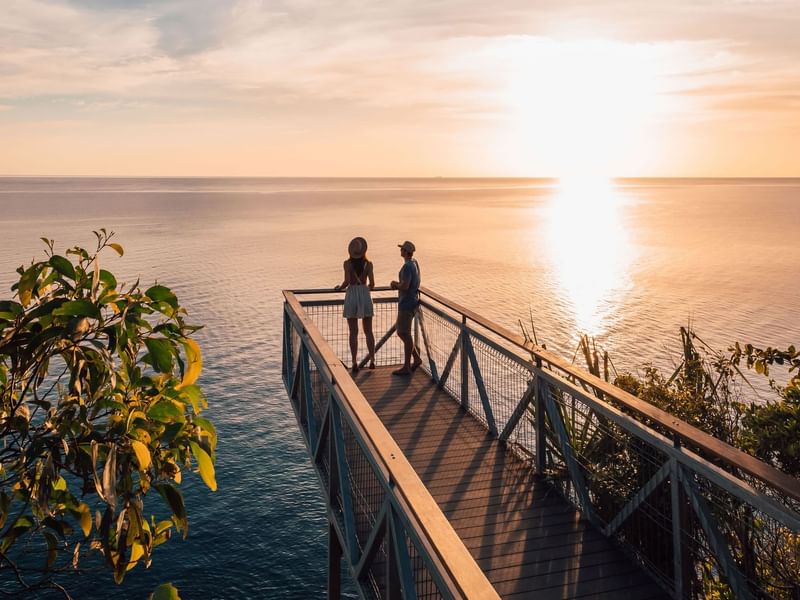 Couple overlooking sea in Flagstaff Hill Lookout at 	
Pullman Port Douglas
