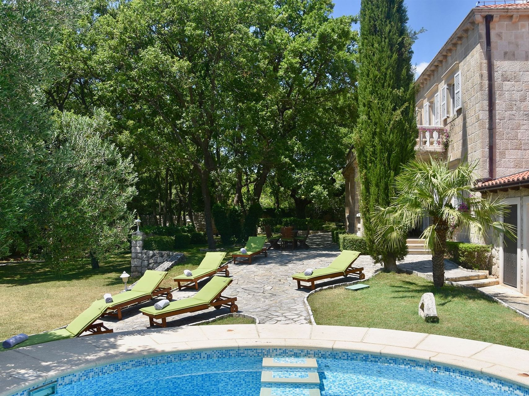 The Pool Area with sun beds at Pervanovo Villa Tereza