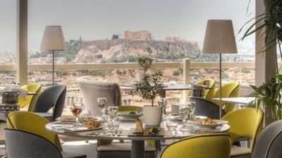 Dining area in La Suite Lounge at St. George Lycabettus
