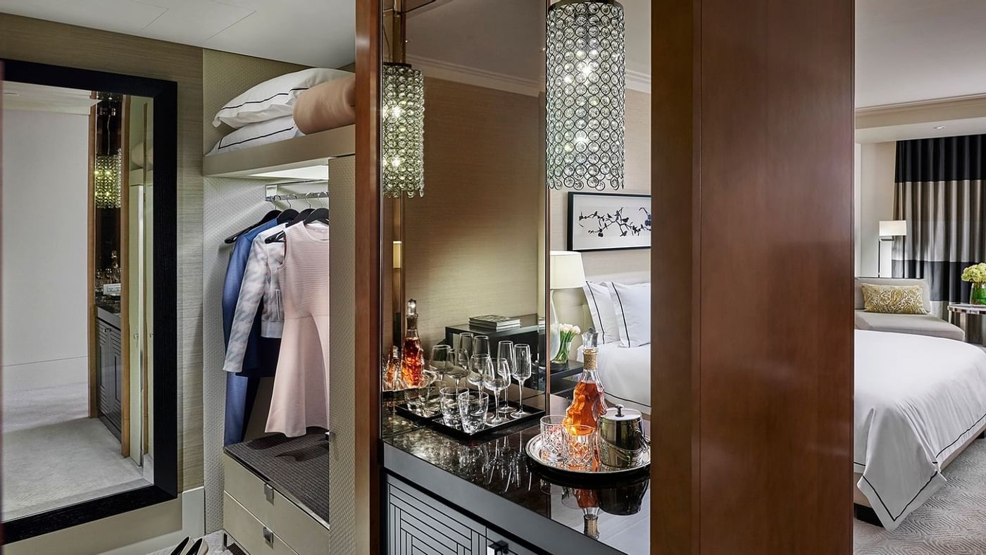 Wardrobe with mirror in a room at Crown Hotels