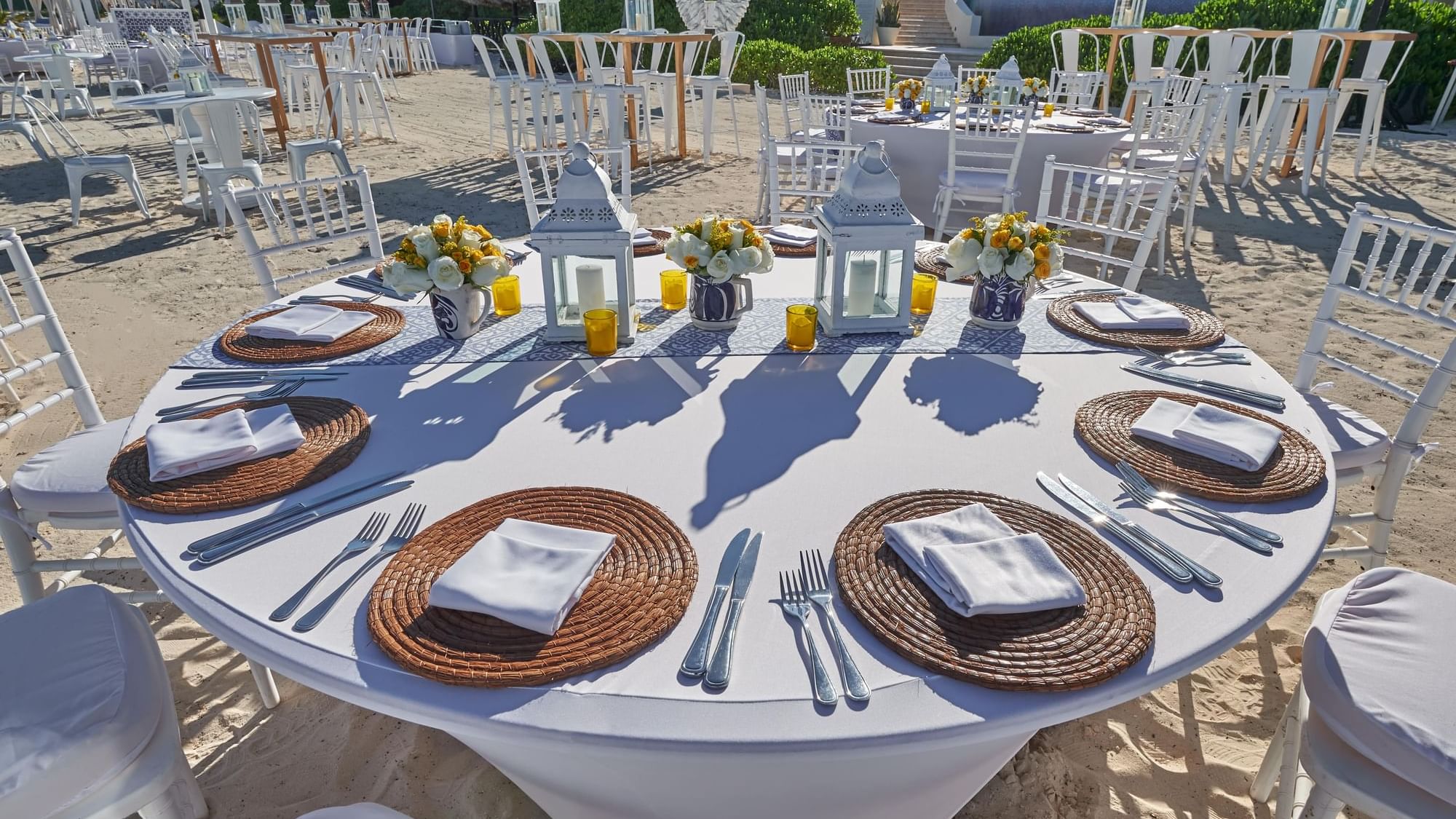 Close-up of a banquet table with culinary on sandy shore at Live Aqua Resorts and Residence Club