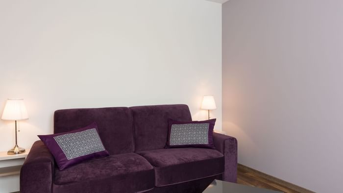 Closeup of a sofa in a lounge area at Le Relais des Carnutes