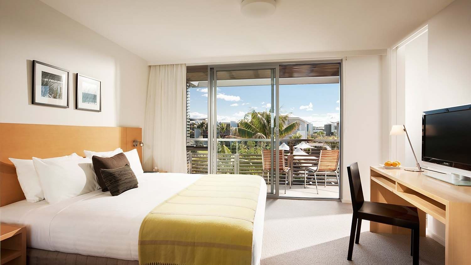 TV facing the king bed in Two Bedroom Villa at Pullman Magenta Shores
