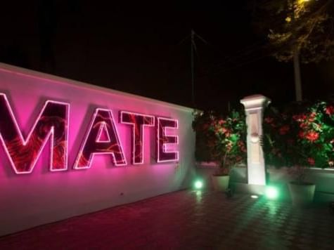 Entrance of Mario Testino Museum at night near Delfines Hotel