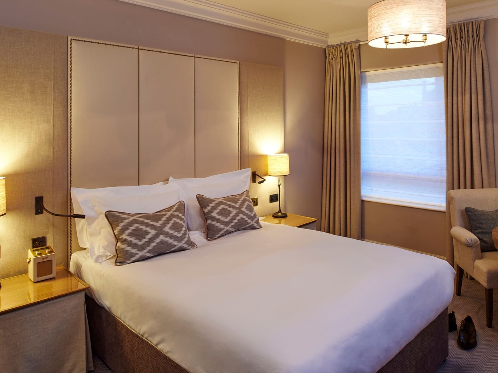 Double bed with a cushioned headboard in Sidings Double Room, York accommodation UK at The Milner York