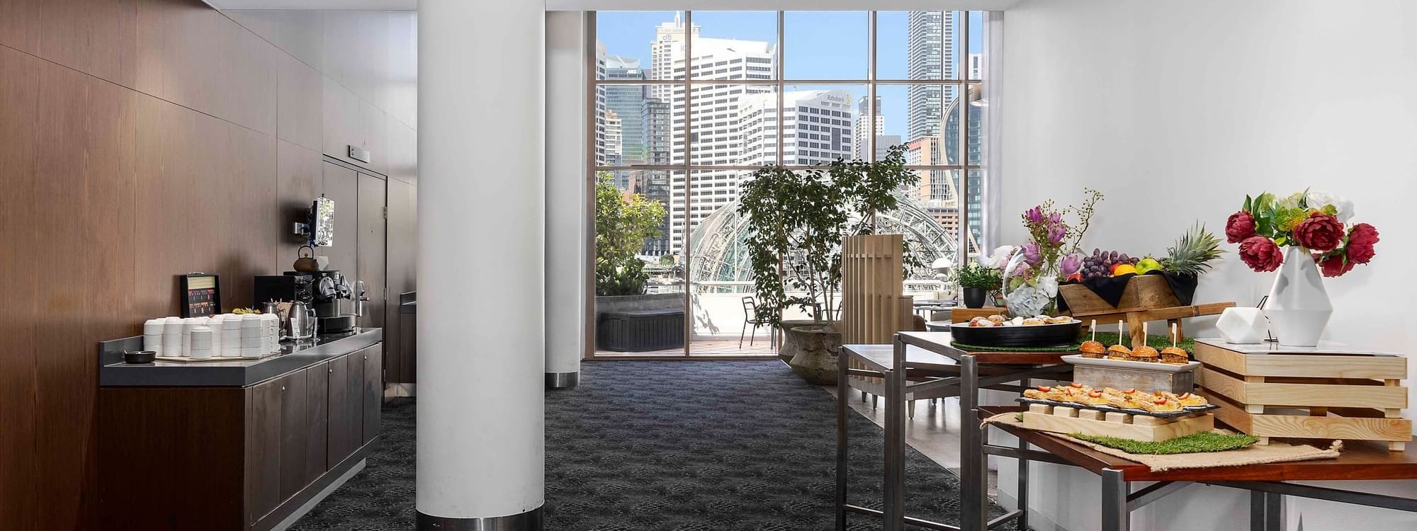 The Hunter Room 3 interior with refreshments, city views, and a large window at Novotel Sydney on Darling Harbour