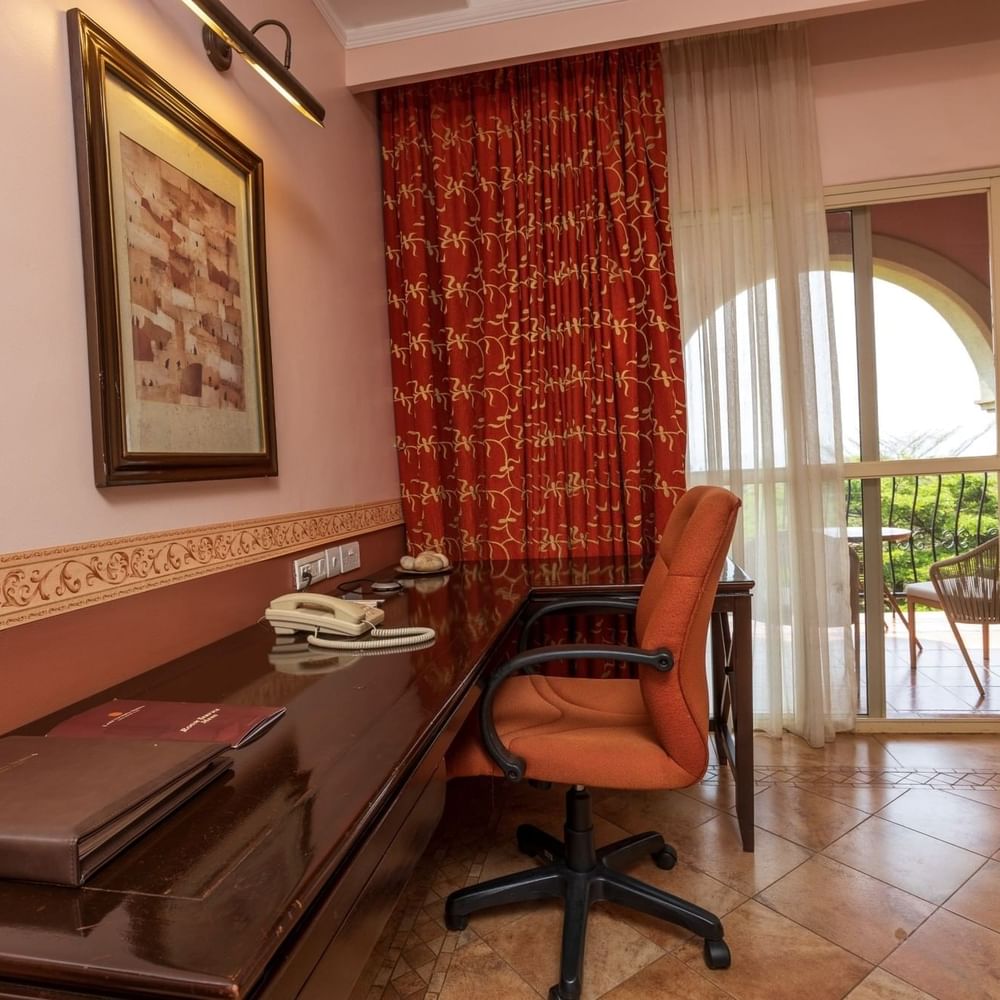 Standard Deluxe Room with work desk and balcony at Lake Victoria Serena Golf Resort & Spa in Kampala.