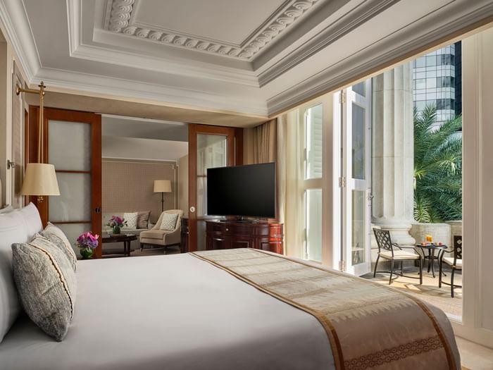 Bed and furniture in Premier Collyer Suite at The Fullerton Hotel Singapore
