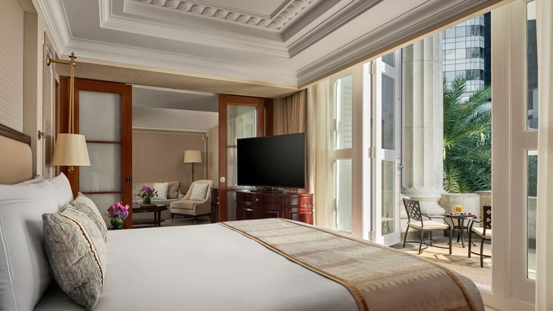 Bed and furniture in Premier Collyer Suite at The Fullerton Hotel Singapore