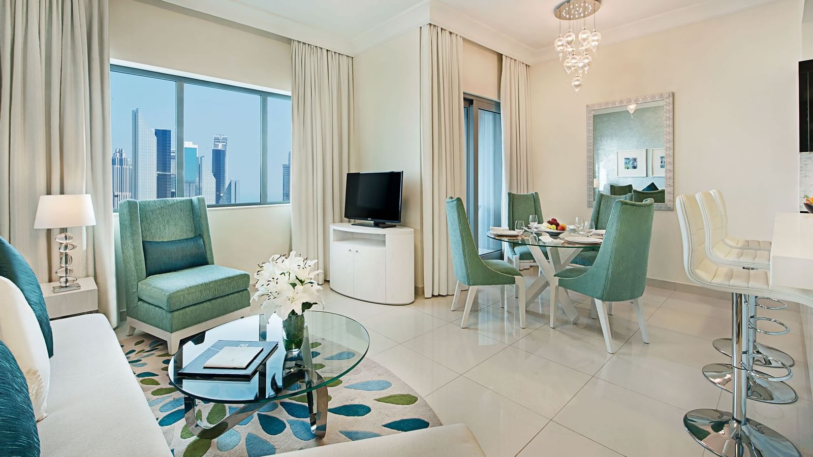 Living area with city view in a Three Bedroom Suite, one of the hotel rooms in Dubai at DAMAC Maison Mall Street