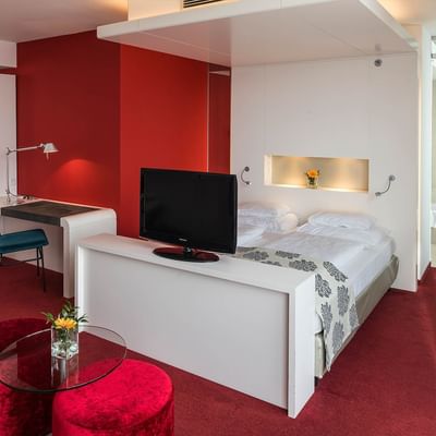 Bed & lounge in Junior Suite at Falkensteiner Hotel Bratislava