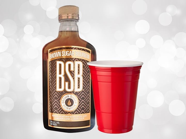 Bottle of Brown Sugar Bourbon and red cup