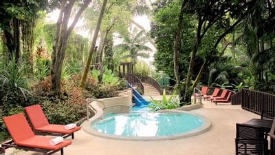 Sunbeds beside a plunge pool outside at Amara Sanctuary Resort