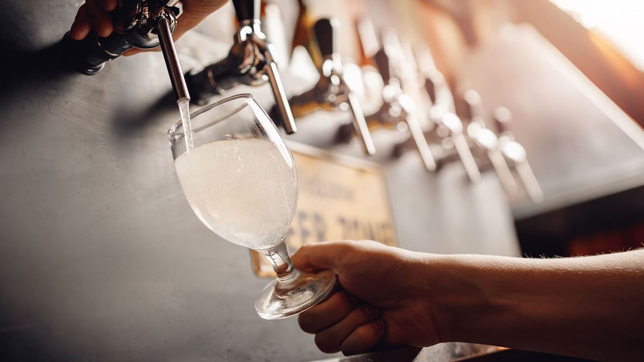 Pouring cider from a tap at The Oceanside Hotel