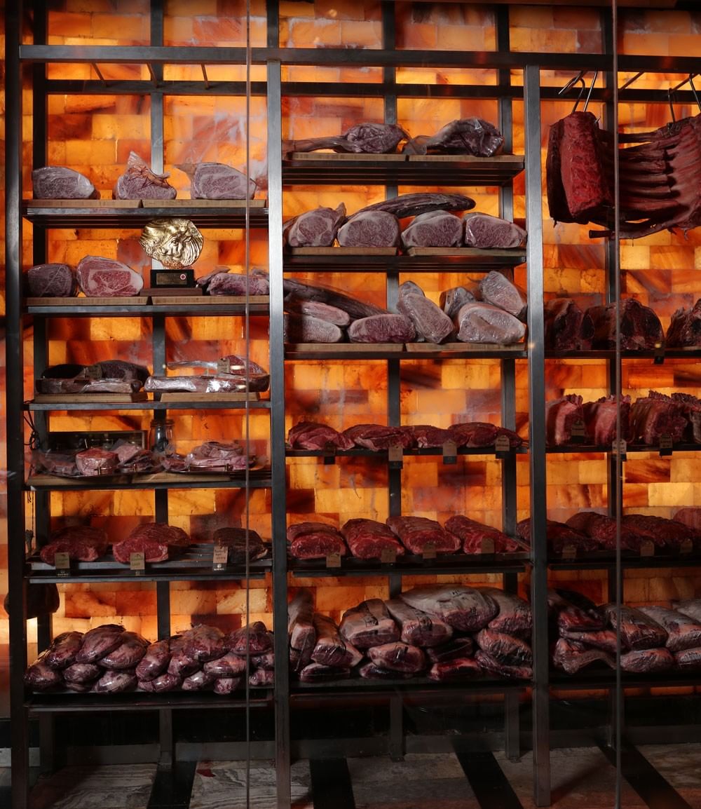 A cold room filled with cuts of beef