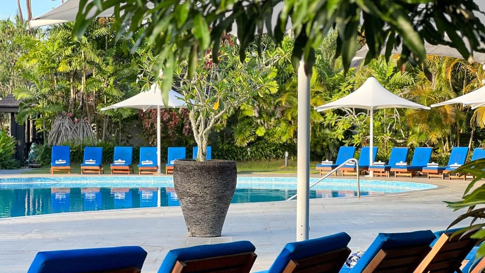 Lounge chairs surround the swimming pool at The Naviti Resort in Korolevu.