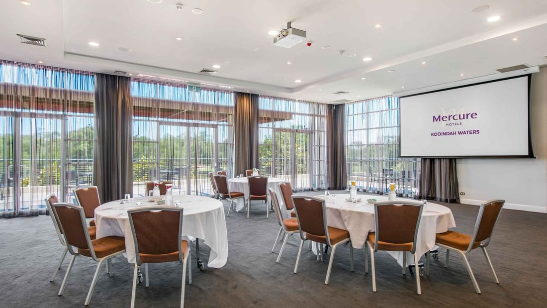 Conference room with large windows and sheer curtains with lots of space at Mercure Kooindah Waters