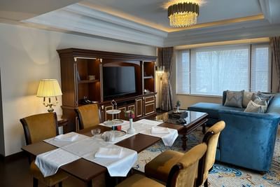 Luxury dining table & living room in Grande Suite at The Indus Valley Leh, Hotel Stay in Leh