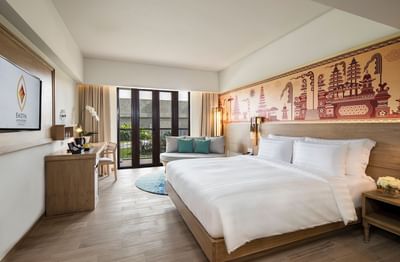 Bed with TV area in Superior Room at Eastin Ashta Resort Canggu