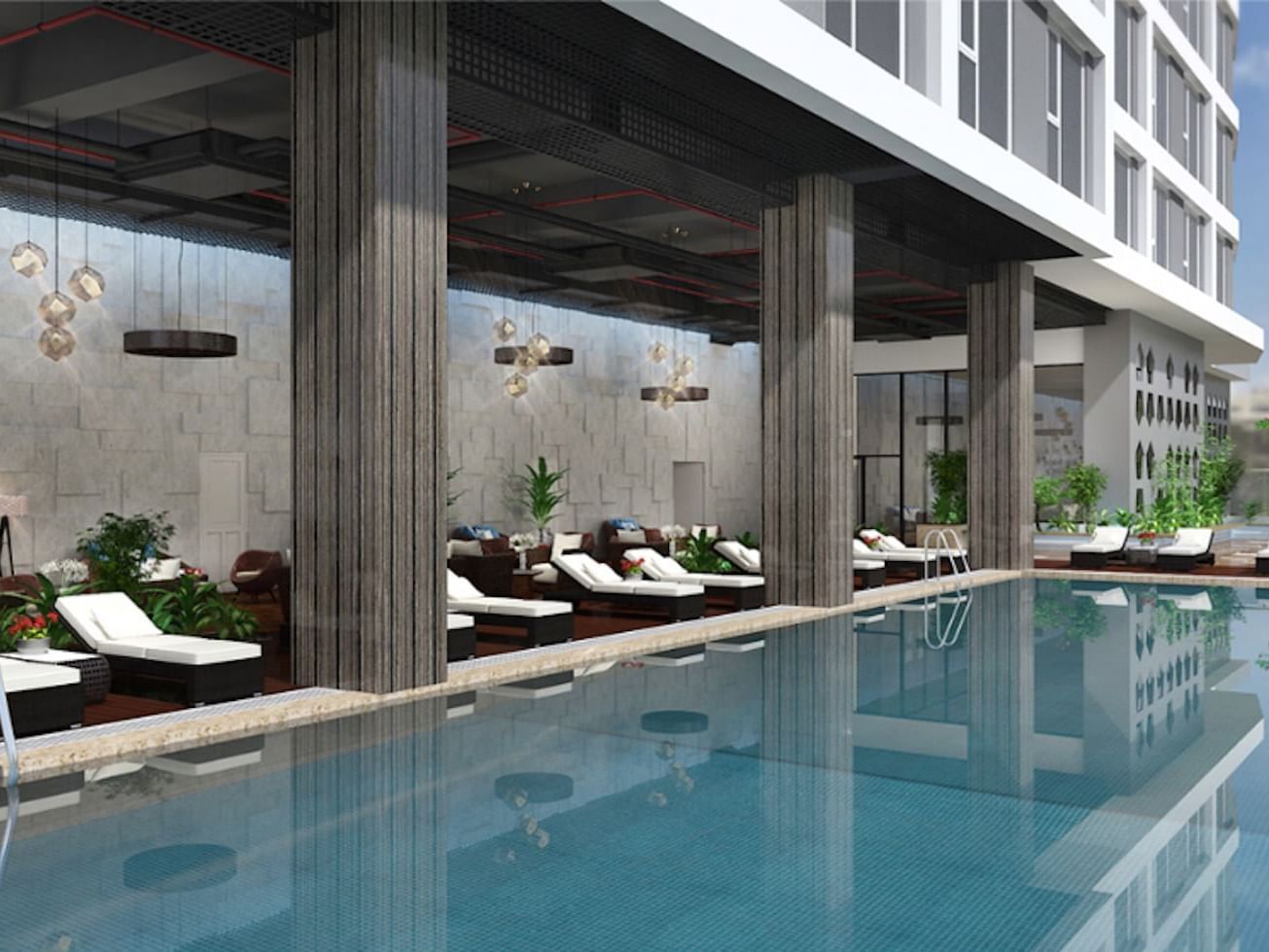 Modern outdoor swimming pool with lounge beds at Easton Hotels