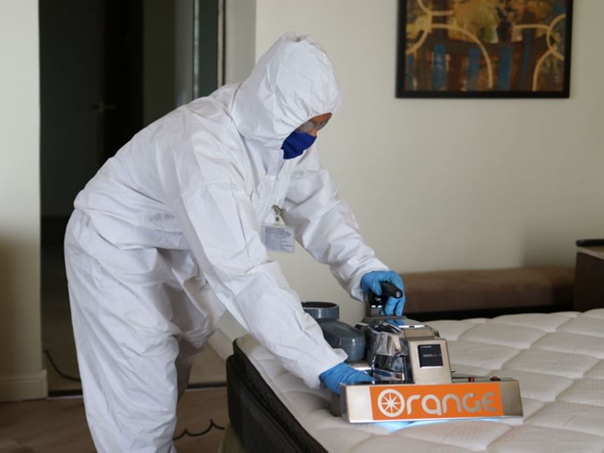 Staff wearing protection & cleaning room, Hotel Coral y Marina